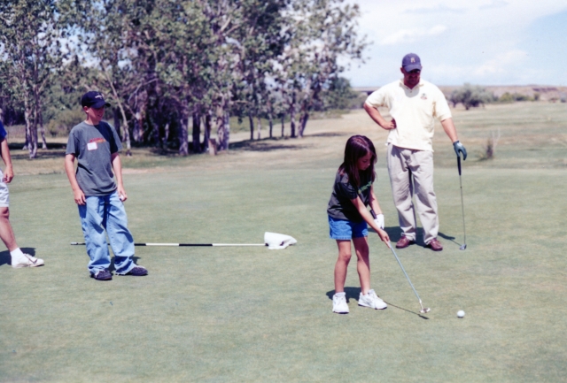 Amber Pimley makes a long putt during the Camp Cole golf tournament.