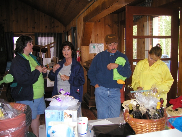 Judy and Martin ONeil check out the raffle baskets at the front door of the Lodge.
