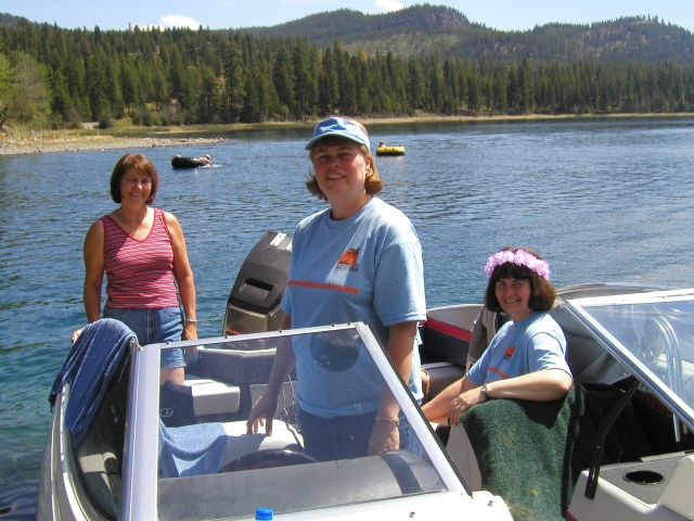 Connie Anderson, Mary Ann Moog, and Patty Smith go for a cruise on the lake.