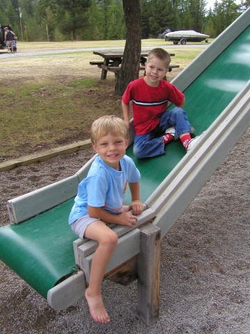 Nate Evans and his friend have great fun on the slide.