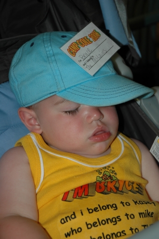 Young McLain catches a few Zs while his Mom works in the kitchen.