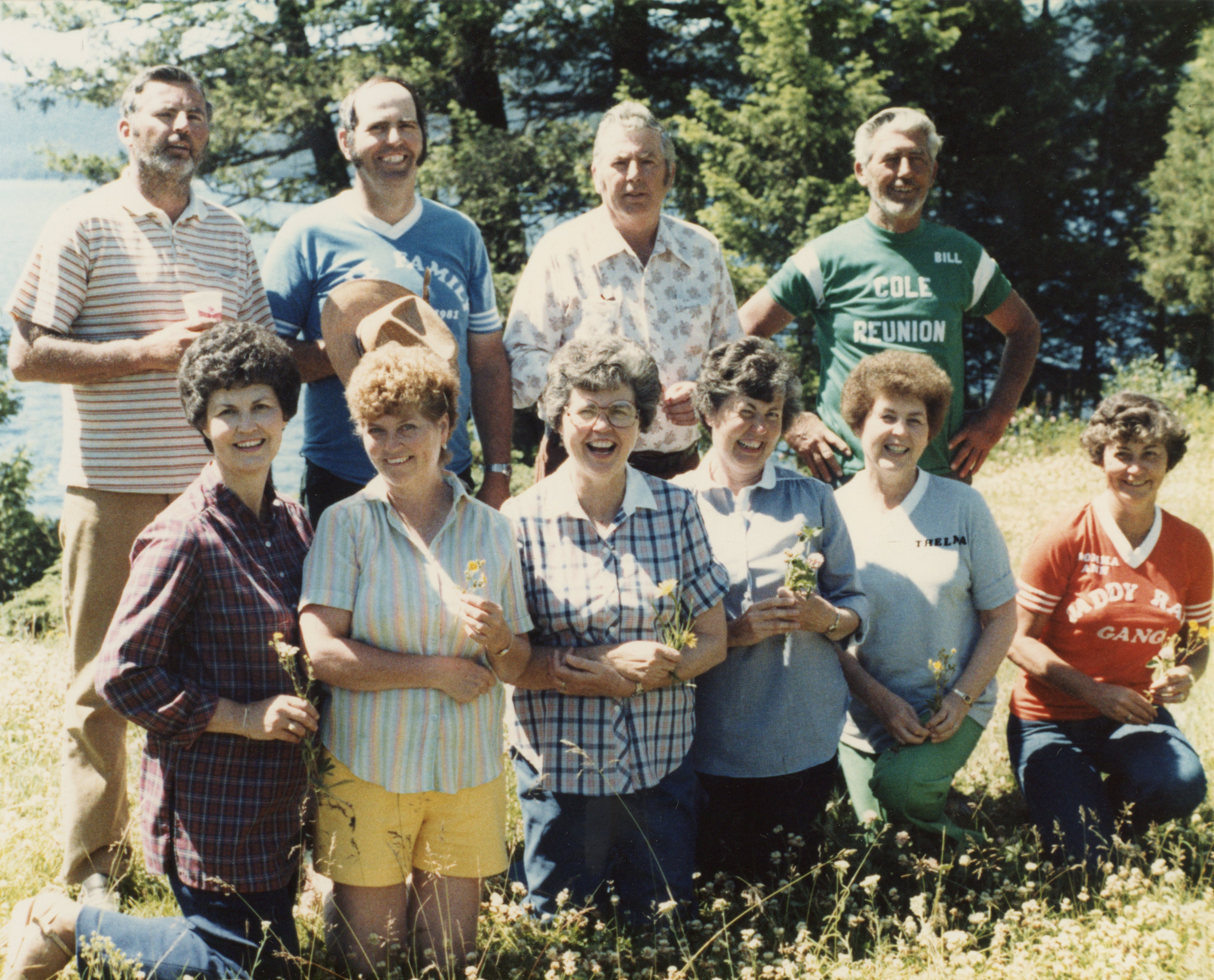 Wilford and Marie Cole children, back row:  Tom, Jim, Dick and Bill Cole and front row:  Jean Stengem, Lois Waller, Della Pimley, Dorothy Solomon, Thelma McLain, and Ann LaCroix enjoy the 1981 Camp Cole Reunion near Kalispell, Montana.